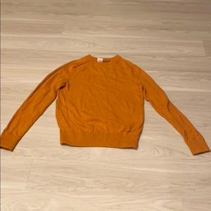 Speckled orange sweater